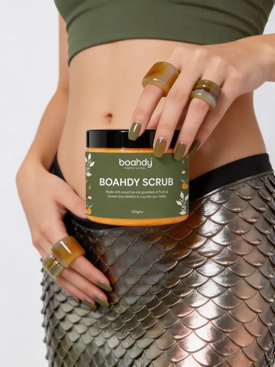 Holding a BOAHDY scrub jar in a silver scaled skirt